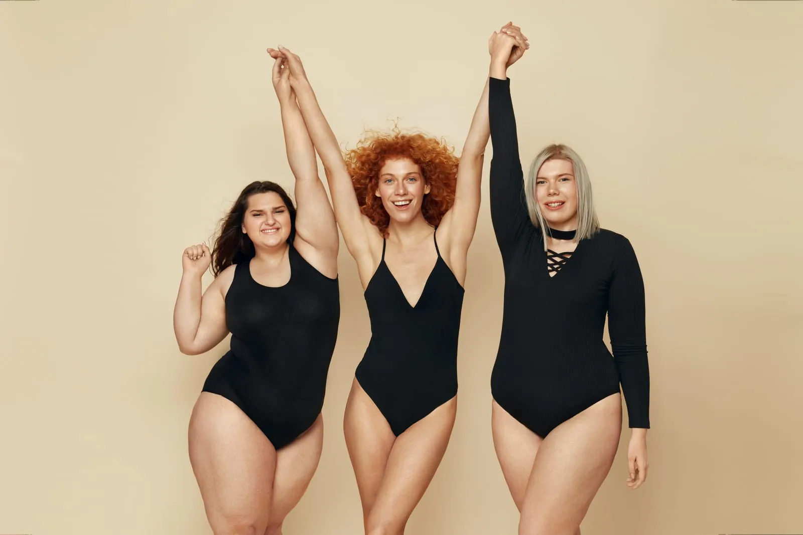 Three women in black swimsuits cheer, illustrative image for GLP-1 therapy