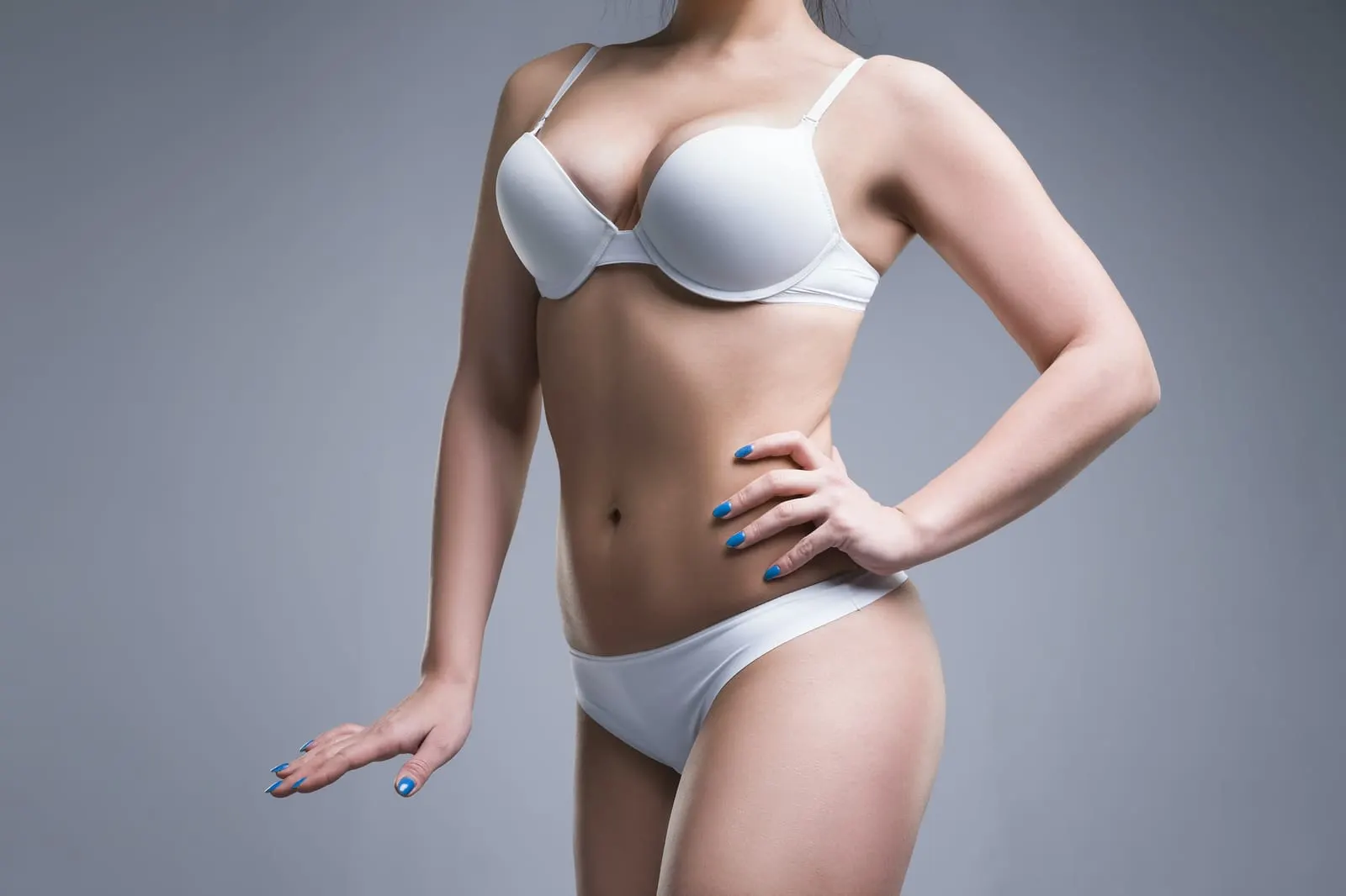 Woman in white underwear, illustrative image for fat harvesting from the abdomen and hips