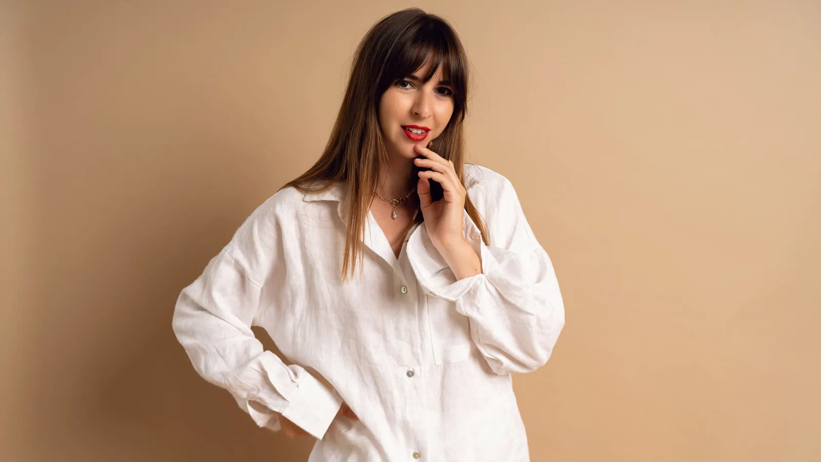 Woman in a white linen shirt against a beige background, illustrative image for GLP-1 therapy