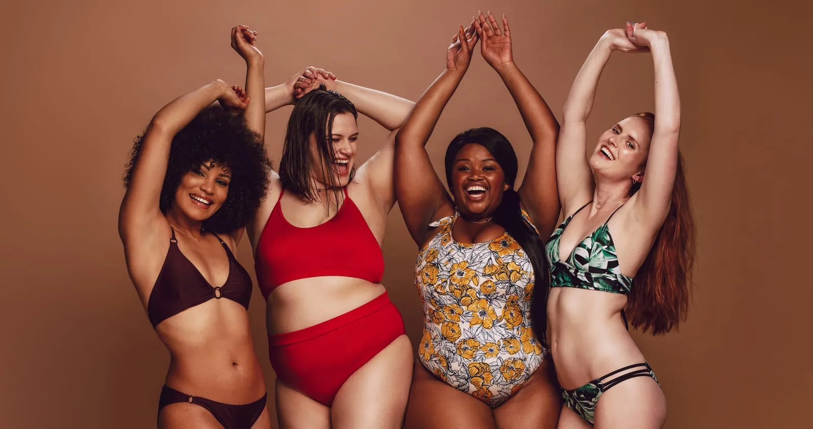 Four women in swimsuits laugh together, illustrative image for GLP-1 therapy